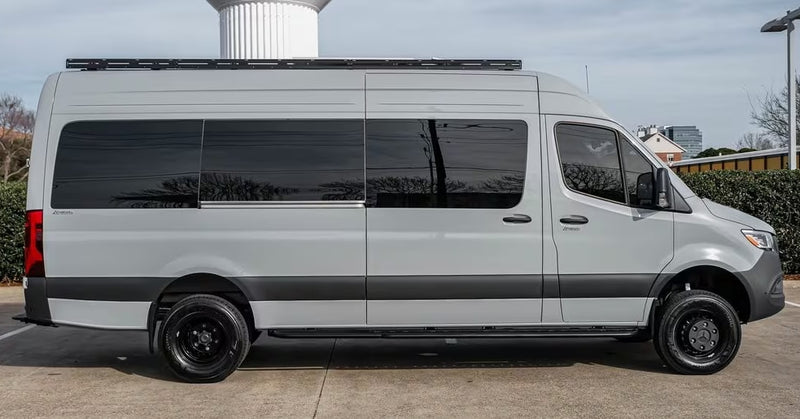 Grey Mercedes-Benz Sprinter van, equipped with a roof rack and tinted windows, ready for your next RV rental adventure. — photo 2
