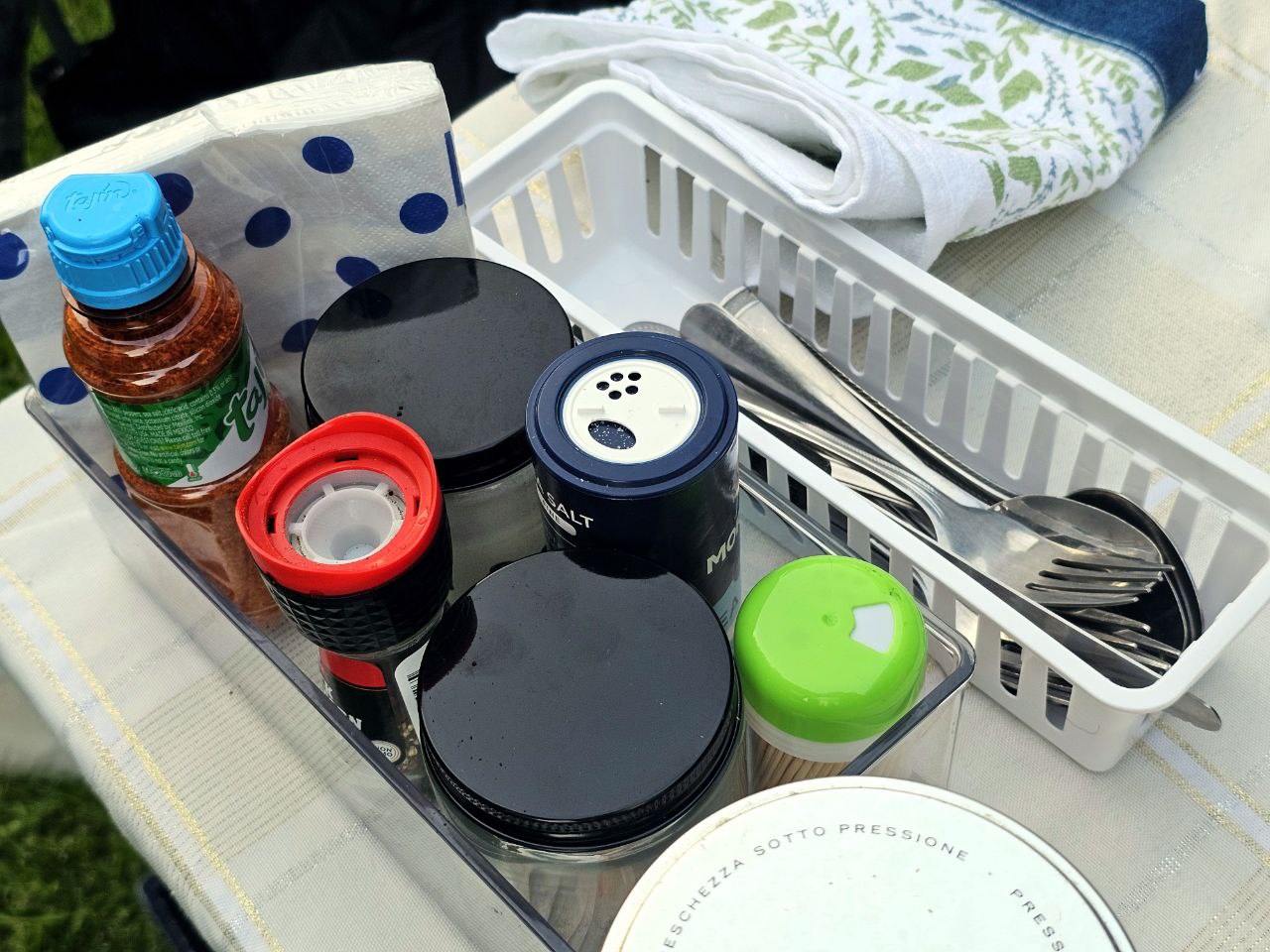 RV rental portable kitchen organizer with salt, Tajín, spices, napkins, and cutlery for convenient travel cooking. — photo 17