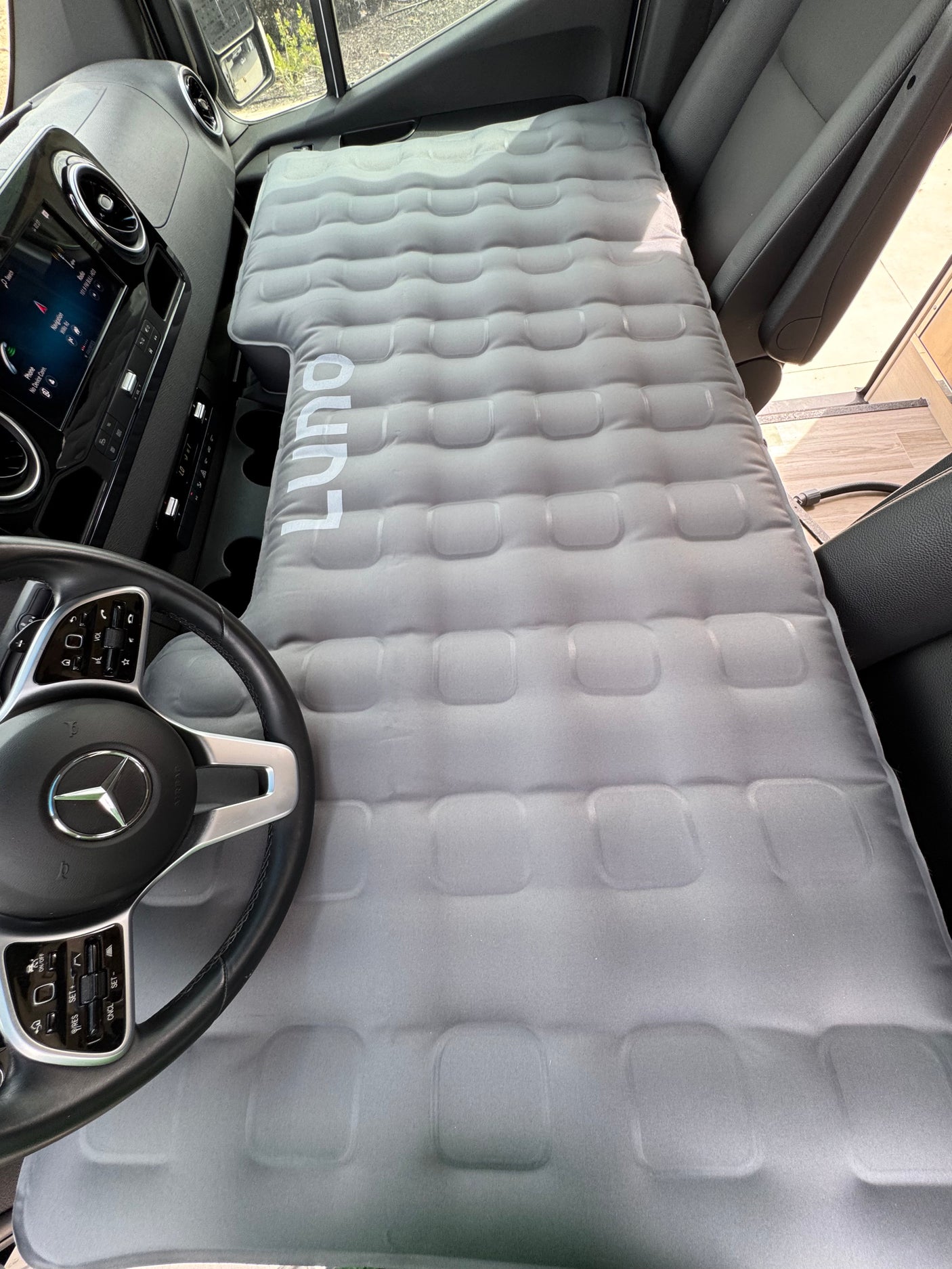 RV rental: A Luno air mattress converts the front cabin of a Mercedes-Benz van into a comfortable sleeping area.
