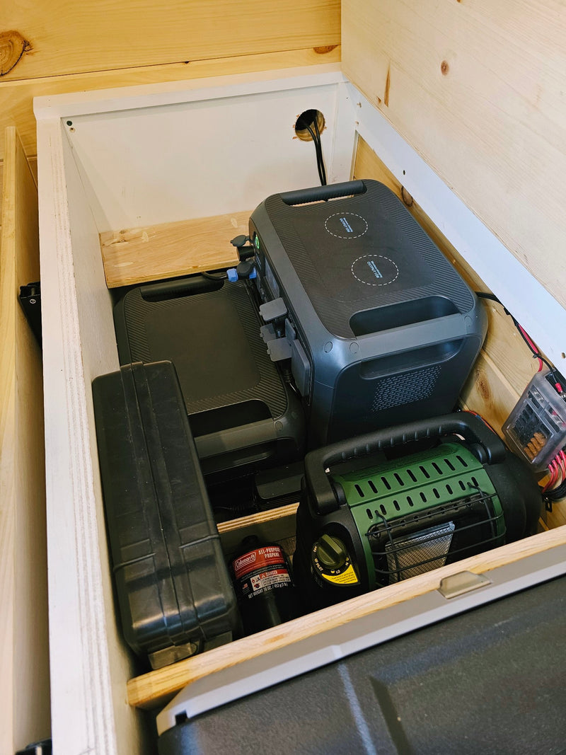  and oven mitts for easy access in your RV rental.|RV rental storage: Neatly rolled red towels in an open overhead cabinet with wood paneling below.|RV rental organized storage: Two soft — photo 4