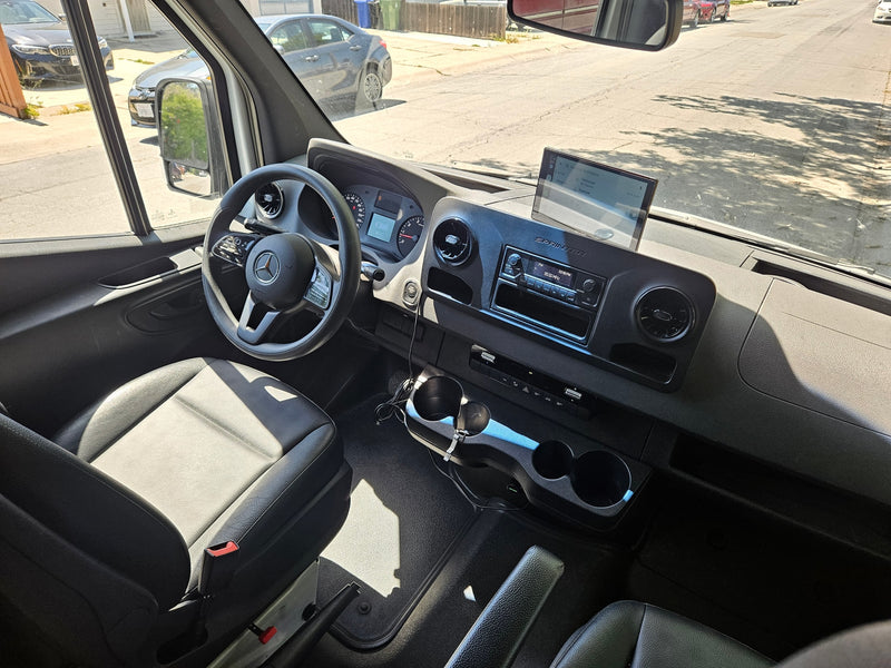 RV rental: Mercedes Sprinter van's interior. Driver's view of dashboard, steering wheel, and navigation to Vancouver/Fremont. — photo 5