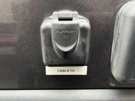 Connect your RV rental to cable TV via this Furrion TV outdoor port. Essential for entertainment on your travels.