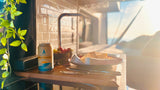 Cozy RV rental interior with a non-alcoholic beer, cheese, and fruit, bathed in golden hour light. Travel bliss!