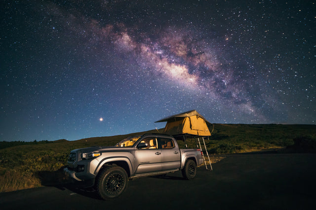 Stargaze from your RV rental! A Tacoma truck with rooftop tent under the vibrant Milky Way, ideal for remote camping.
