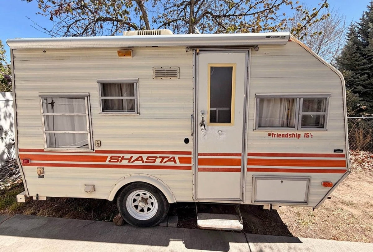 This cream-colored vintage Shasta travel trailer — photo 1