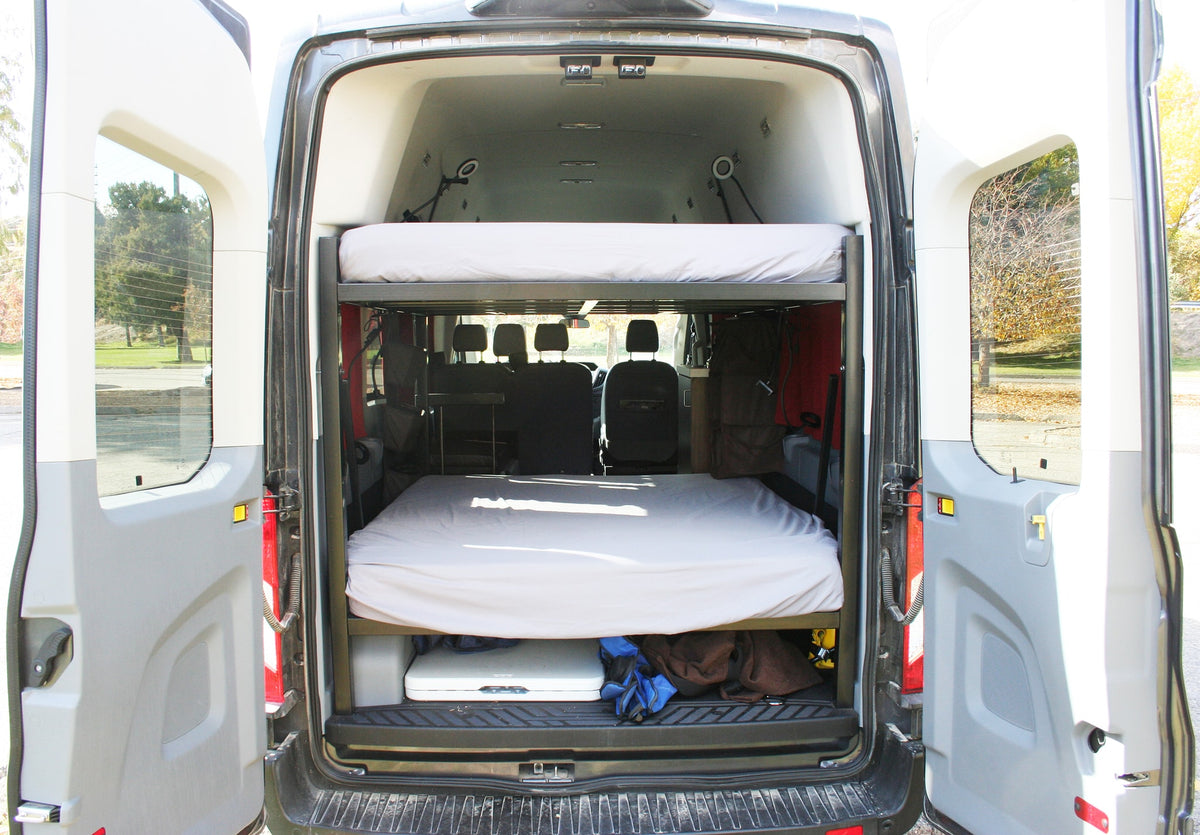 Inside this RV rental camper van: stacked bunk beds and under-bed storage for your next adventure. — photo 5