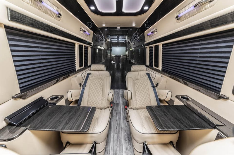 and wood-look flooring visible through an open door.|This silver Mercedes-Benz Sprinter luxury van — photo 3