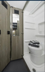  perfect for meals on the road.|Cozy RV rental interior: A person relaxes on a bed
