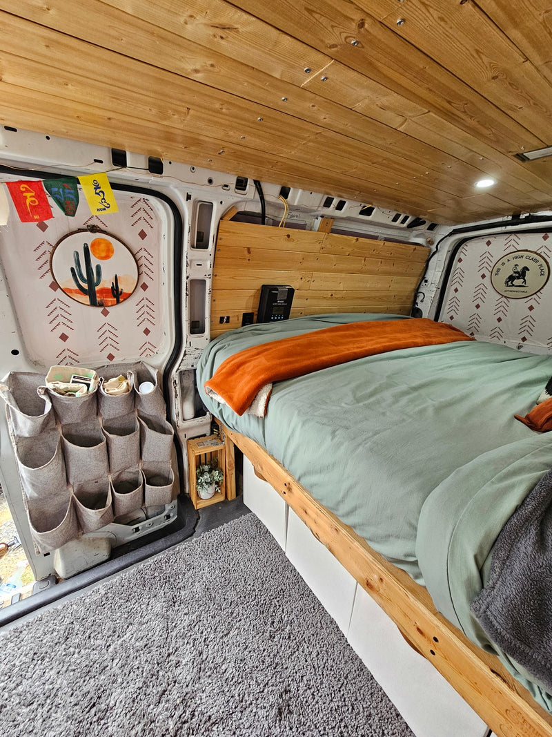  mountains.|This RV rental boasts a cozy kitchenette with wood paneling — photo 20
