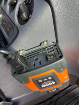 A 400W power inverter with AC outlet and USB ports installed in an rv rental for charging devices.