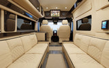 Luxurious RV rental interior features cream quilted seating, a large TV for entertainment, and a spacious, comfortable design.