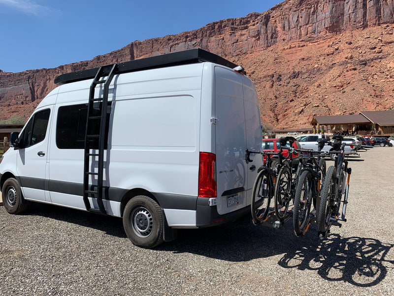 White Sprinter van rv rental equipped with bikes, perfect for exploring red rock landscapes. — photo 2