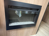 Experience comfort in this RV rental! Features a built-in electric fireplace with a black frame and decorative crystal media.