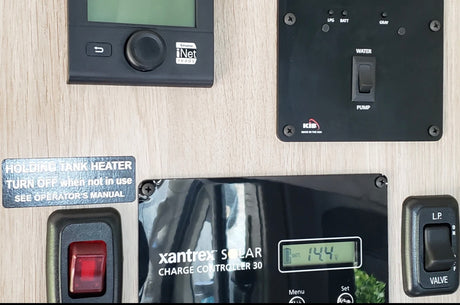 This RV rental panel shows onboard controls: Truma iNet, KIB water pump & tank monitors, Xantrex solar, LP valve, and tank heater switch.