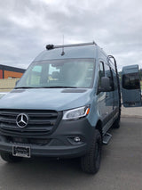 Grey Mercedes-Benz Sprinter camper van, ready for RV rental adventures. Parked outdoors with interior conversion visible.