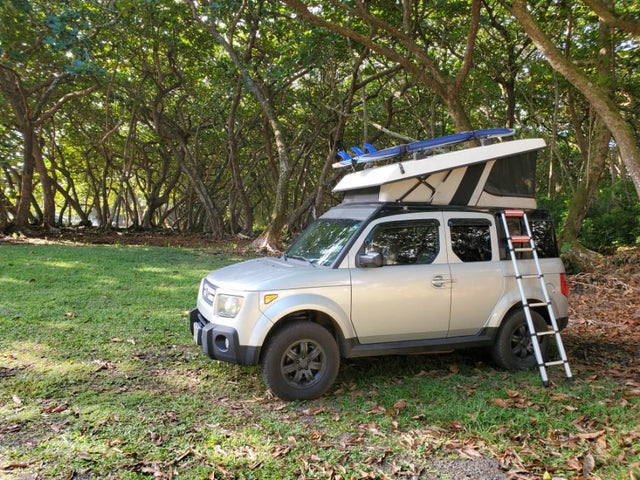  equipped with surfboards and a ladder