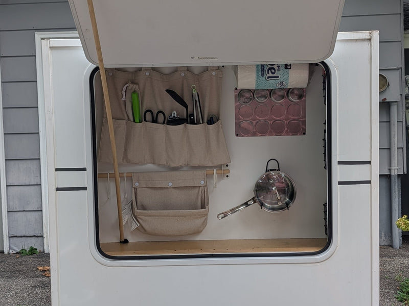  ready for travel and camping.|Compact RV rental bedroom featuring a bed with floral quilt — photo 4