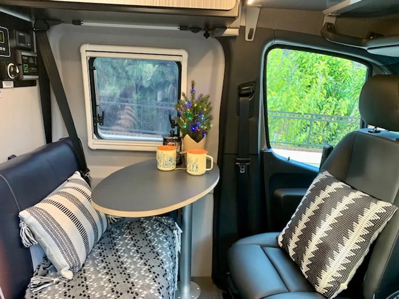  and a portable lantern. Perfect for road trips!|Explore this rv rental's interior: a compact kitchenette — photo 5