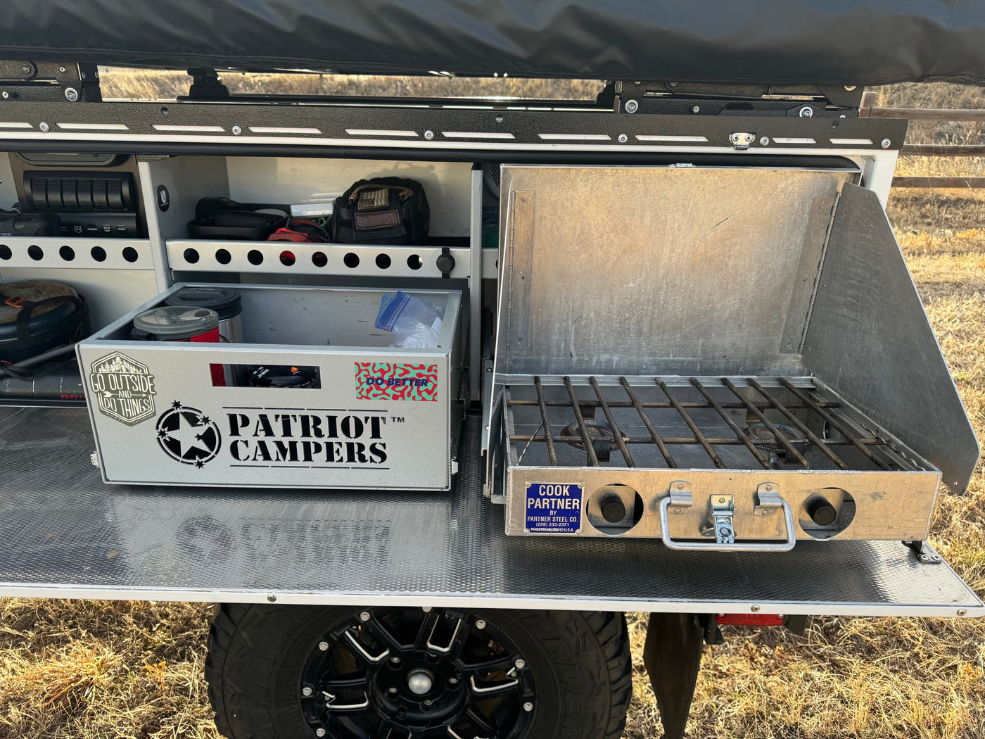 Overlanding kitchen setup: pull-out stove, storage for a Patriot Campers box. Perfect for your rv rental adventure. — photo 9
