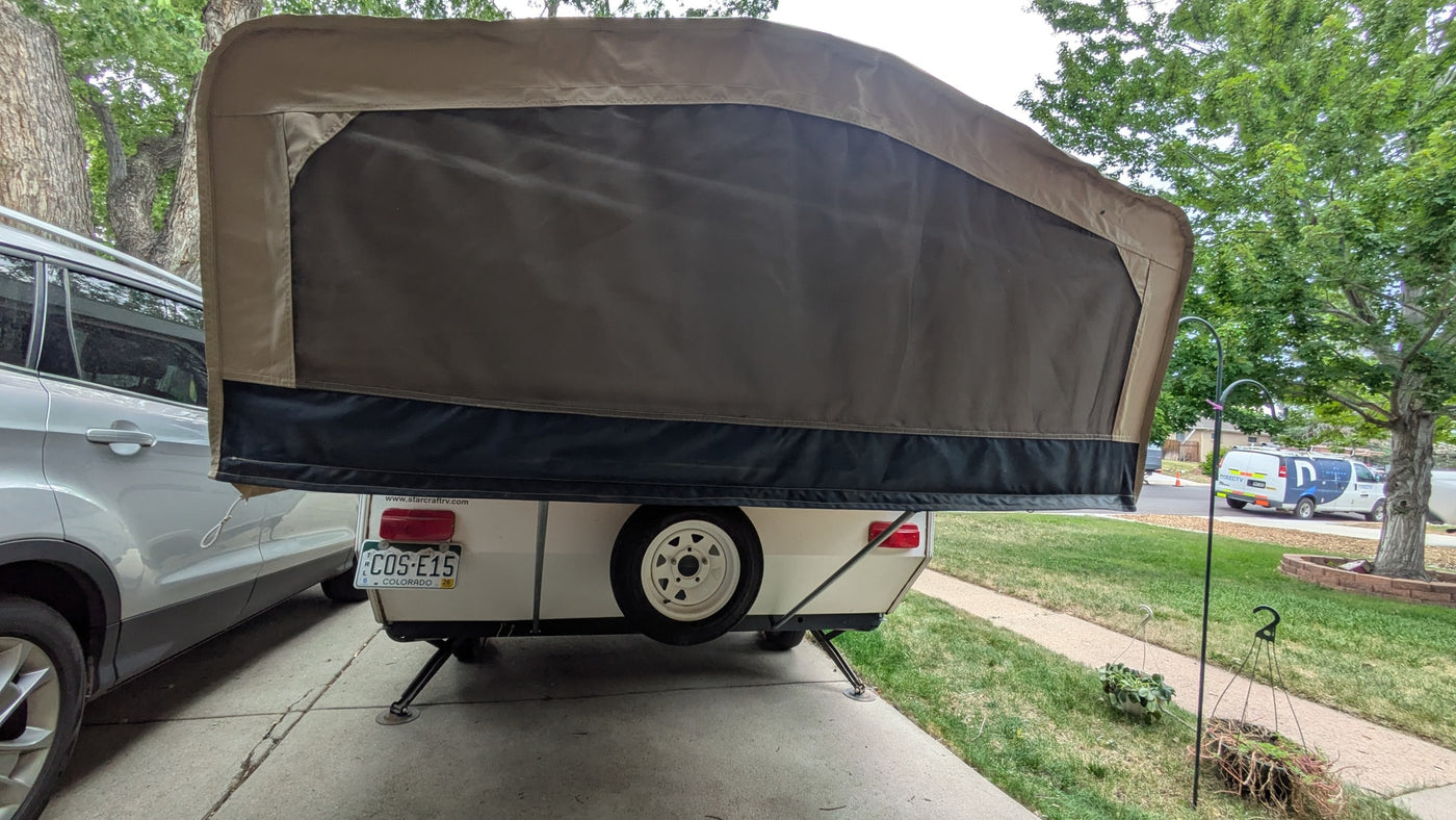  and fabric walls.|Interior view of an RV rental pop-up camper's kitchen/storage unit — photo 6