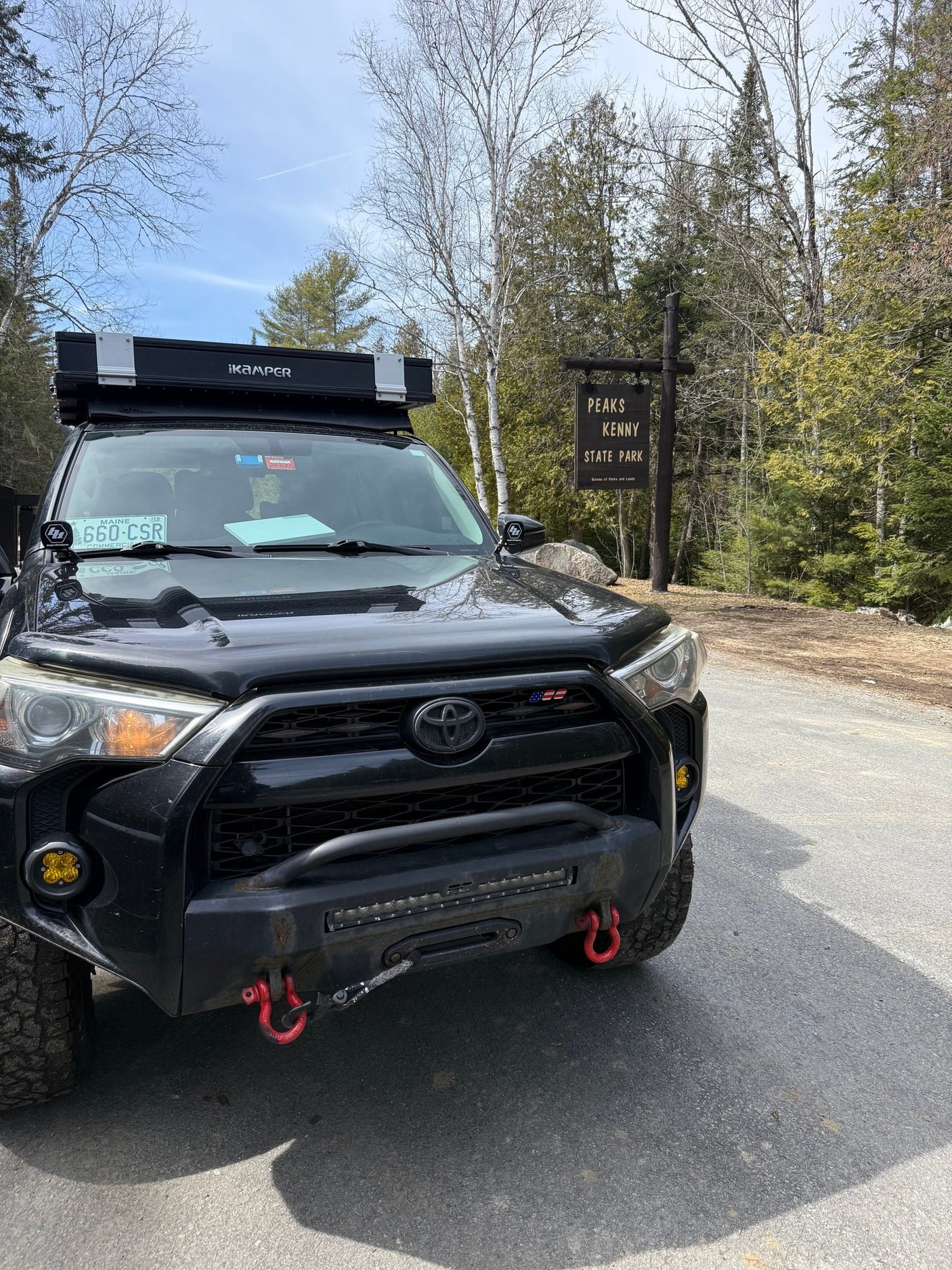 Black Toyota 4Runner with iKamper rooftop tent, perfect for an adventurous rv rental trip, at Peaks Kenny State Park.