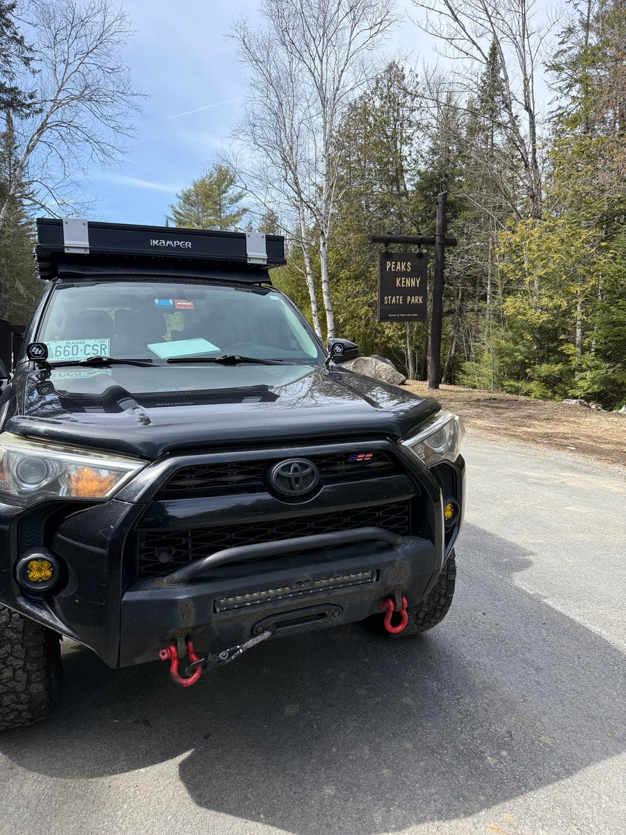 Black Toyota 4Runner with iKamper rooftop tent, perfect for an adventurous rv rental trip, at Peaks Kenny State Park.