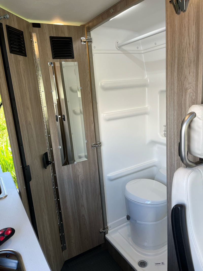  and control panels. Ready for your next adventure!|Spacious rv rental camper van interior. Features light seating — photo 9
