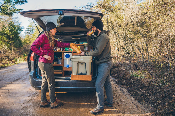  ready for cooking on a camping trip.|Couple shares snacks from their organized car-camping setup