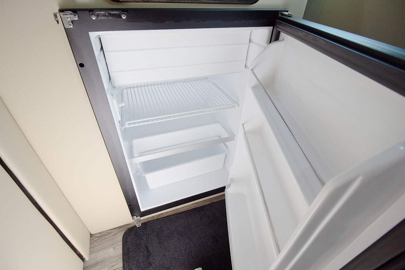  and stylish lighting create a mobile lounge.|Luxury Mercedes-Benz RV rental interior — photo 14
