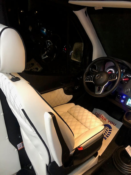 Premium car interior, ideal for your next rv rental journey. Features clean white seats & modern controls.