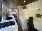 Explore this modern RV rental's interior, featuring a sleek kitchen, dinette, and bright shower space.