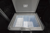 Open Dometic portable RV cooler, with empty dual compartments and wire baskets, ready for your RV rental road trip.