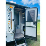 White GEO PRO travel trailer: open entrance with steps, revealing a glimpse of the interior. Great for your rv rental! — photo 6