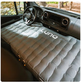 RV rental camper van's front cabin converted into a sleeping area with a LUNA air mattress.