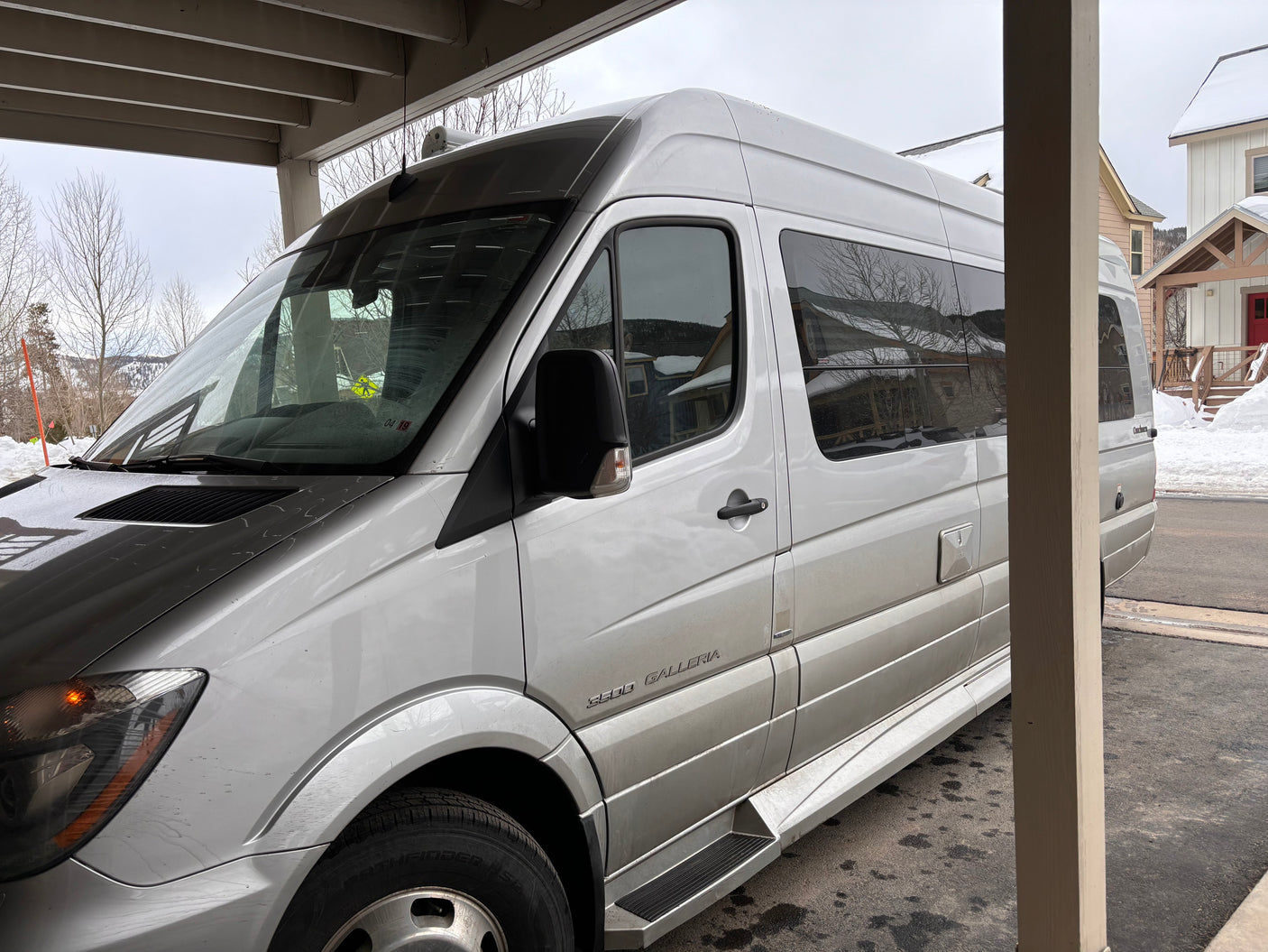Explore this luxurious silver camper van, perfect as an RV rental for your winter road trip adventures.