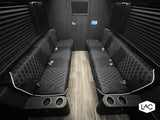 Luxury RV rental interior: comfortable quilted seating, wood floors, and entertainment for group travel.