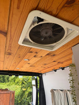  and a compact kitchen. Ideal for van life.|Compact RV rental kitchen featuring a portable dual-burner stove