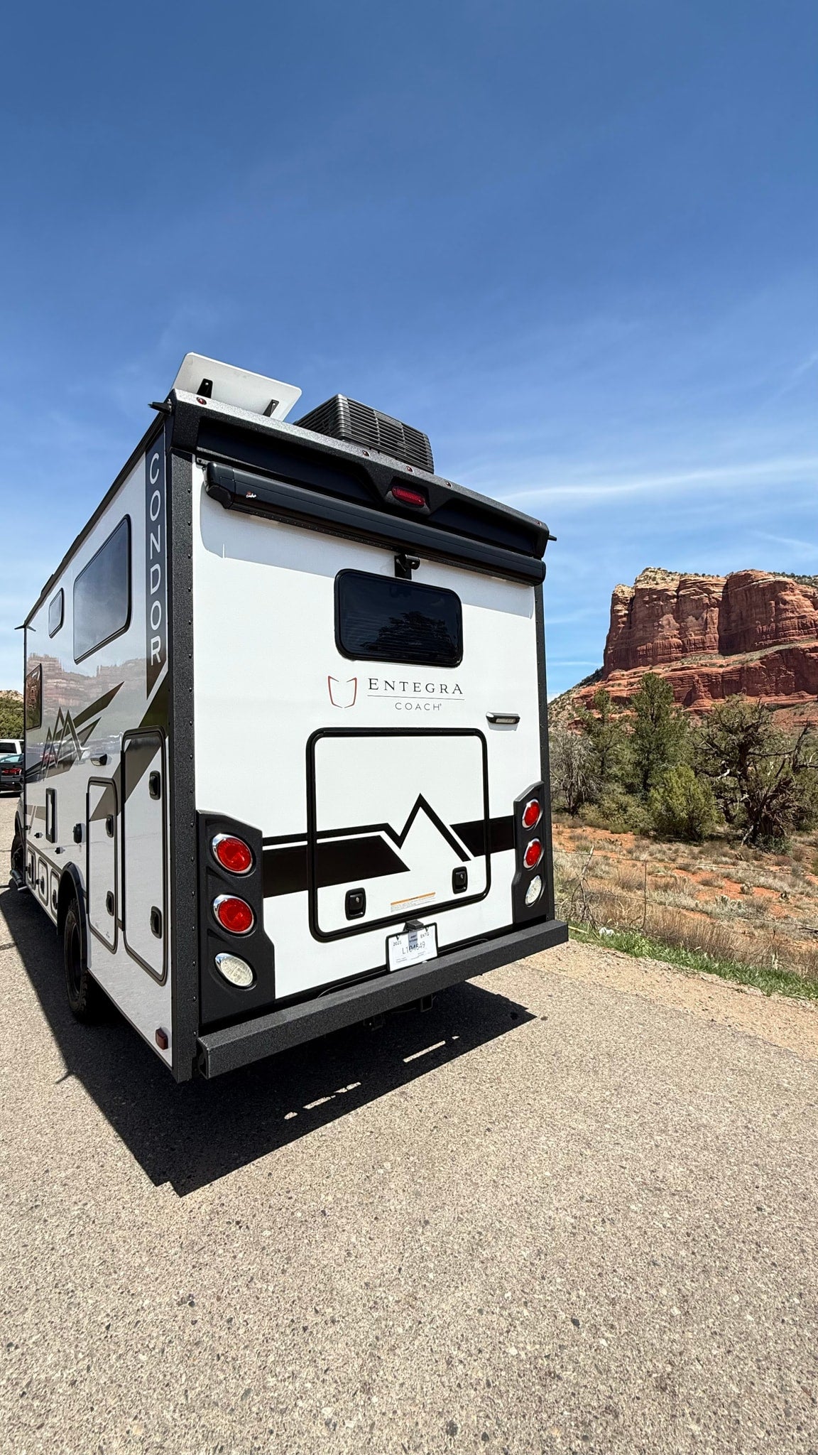  AZ.|White Entegra Coach RV rental parked on asphalt — photo 2