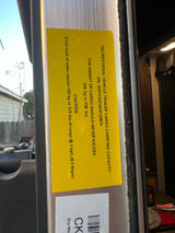 An RV rental's cargo capacity label, detailing max weight (344kg/758lbs) and water weight. Vital for safe loading.
