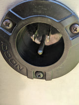 NOCO RV rental charging port showing a male electrical inlet with three pins.