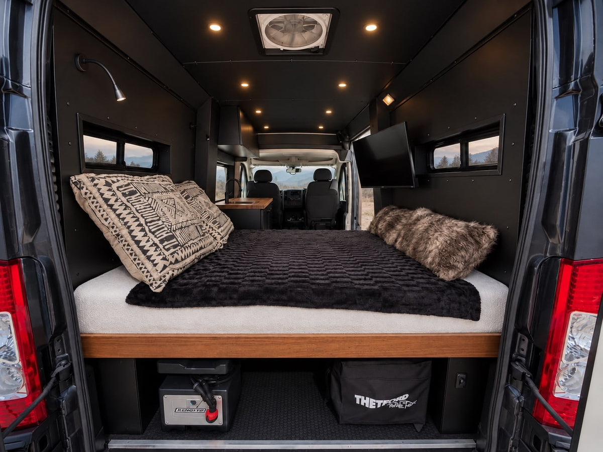 and scenic mountain views for your next adventure.|A modern rv rental interior with a black sink set in a rich wooden countertop — photo 5
