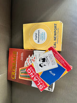 Unplug with Cal Newport's book & games like Cribbage and Slang Flashcards, ideal for your next rv rental getaway.