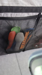 Organized rv rental travel: colorful utensils stored in a mesh pocket for easy access.