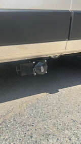 RV rental's undercarriage showing Valterra waste water dump valves, essential for sanitary disposal.