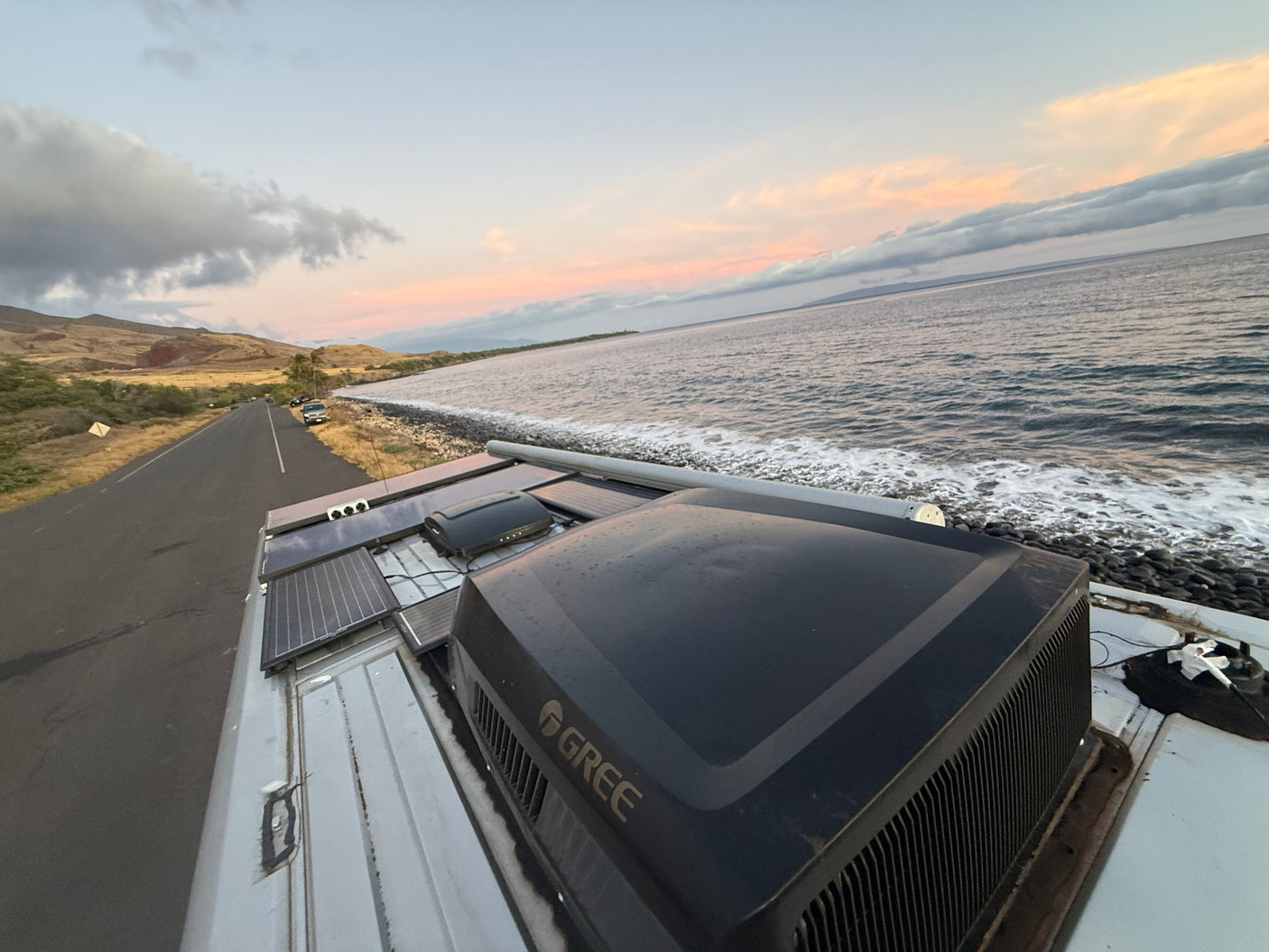 Scenic RV rental: Coastal road, ocean, and sunset from the rooftop. Solar panels & GREE AC unit for comfort.