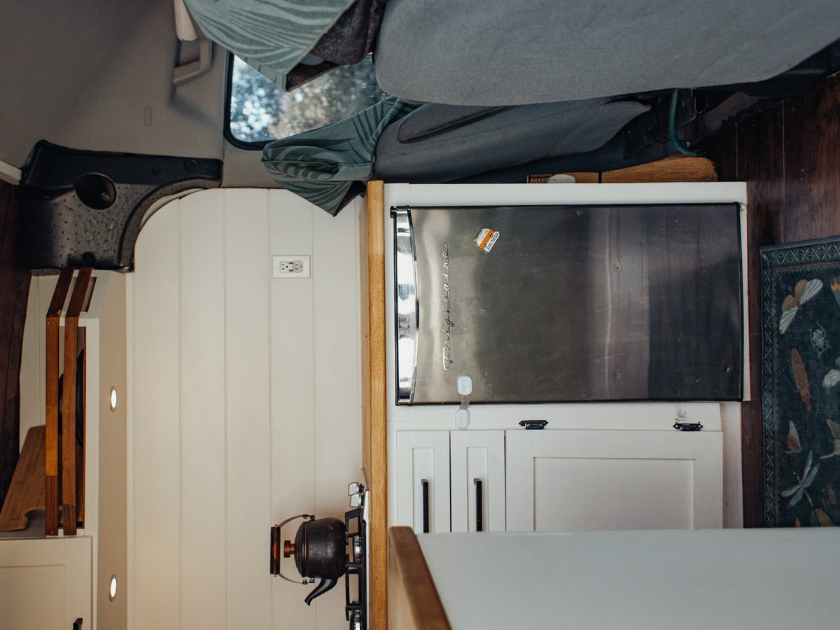 a converted van reveals a compact kitchen with sink — photo 4