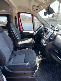  and dining table. A cozy camper van.|Cozy rv rental sleeping area inside a pop-top camper with sunlight illuminating the bed. Perfect for camping.|RV rental wet bath: Thetford toilet — photo 3