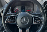 Inside a Mercedes-Benz RV rental: steering wheel, dashboard with "Reserve Fuel" warning. Controls visible.