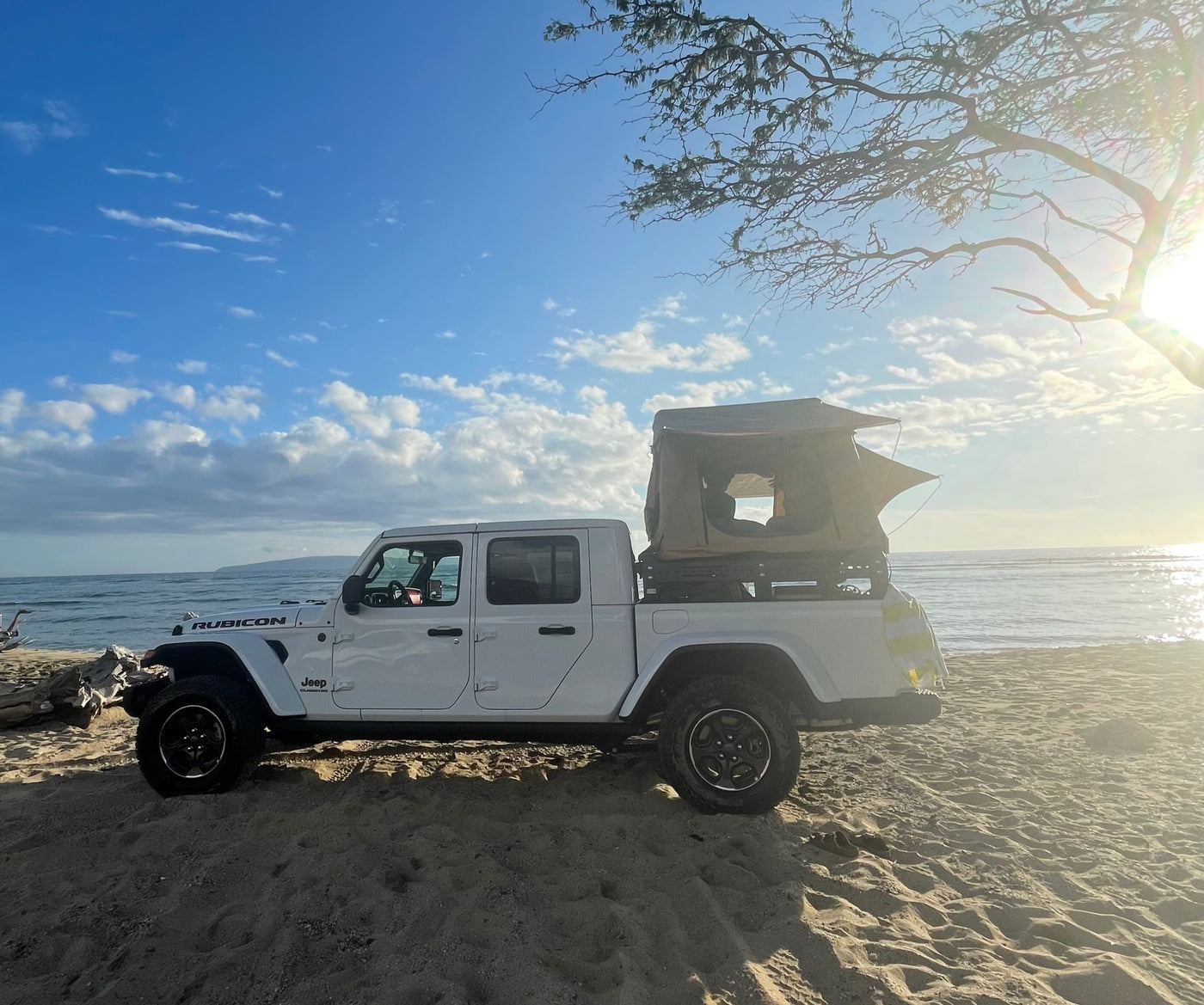 White Jeep Gladiator with rooftop tent on a sandy beach at sunrise, ideal for an RV rental adventure by the ocean. — photo 3