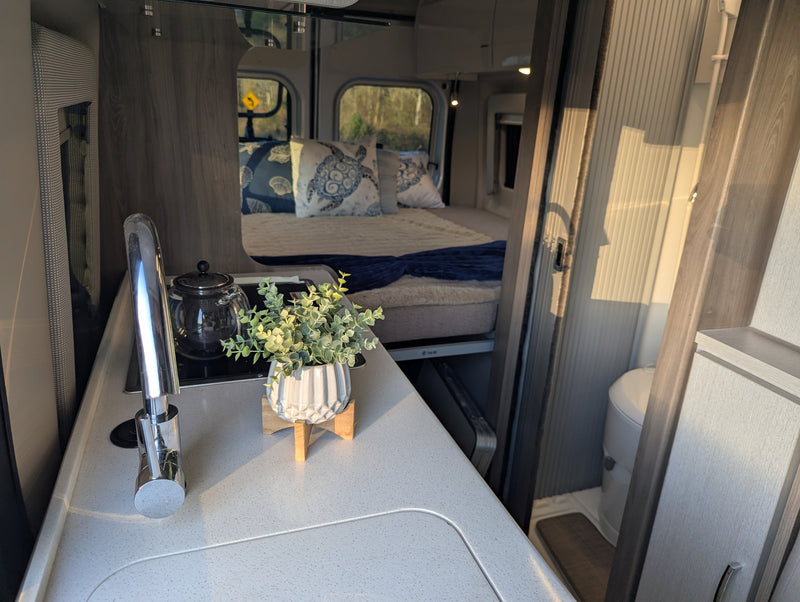  and two back windows to the outdoors.|Inside this RV rental camper van — photo 12